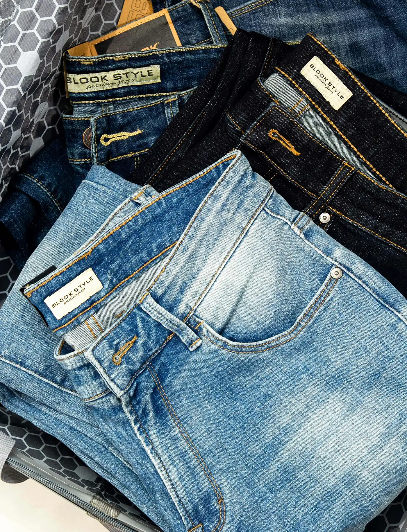 Bundled denim selvedge rolls on the inspection table