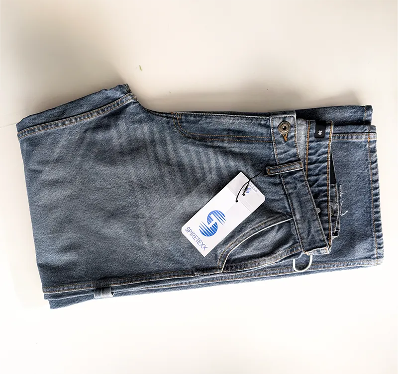 Denim on the finishing conveyor with vapour rising off it