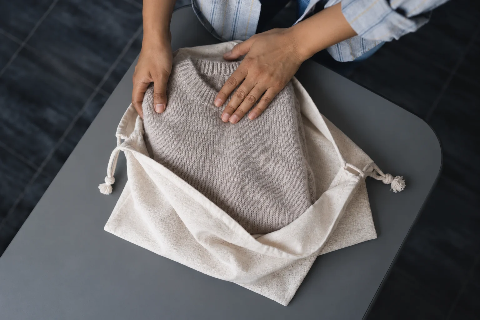 Packing a knit sweater for shipping